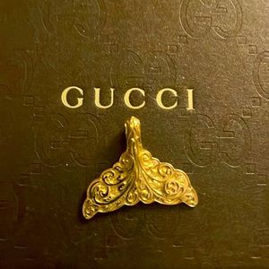 Gucci 18 kt gold whale’s tail pendant